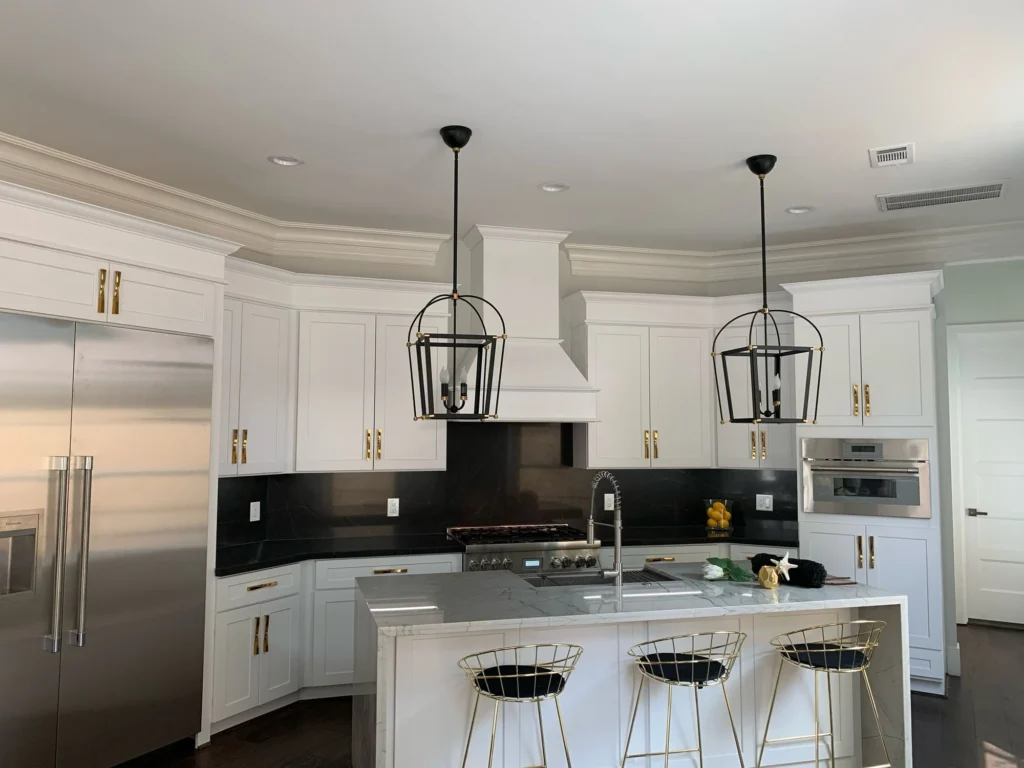 Ella Residence — Kitchen with lantern pendants and island seating
