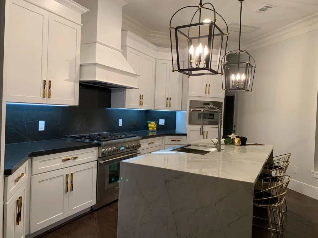 Ella Residence — Kitchen with waterfall island and professional range