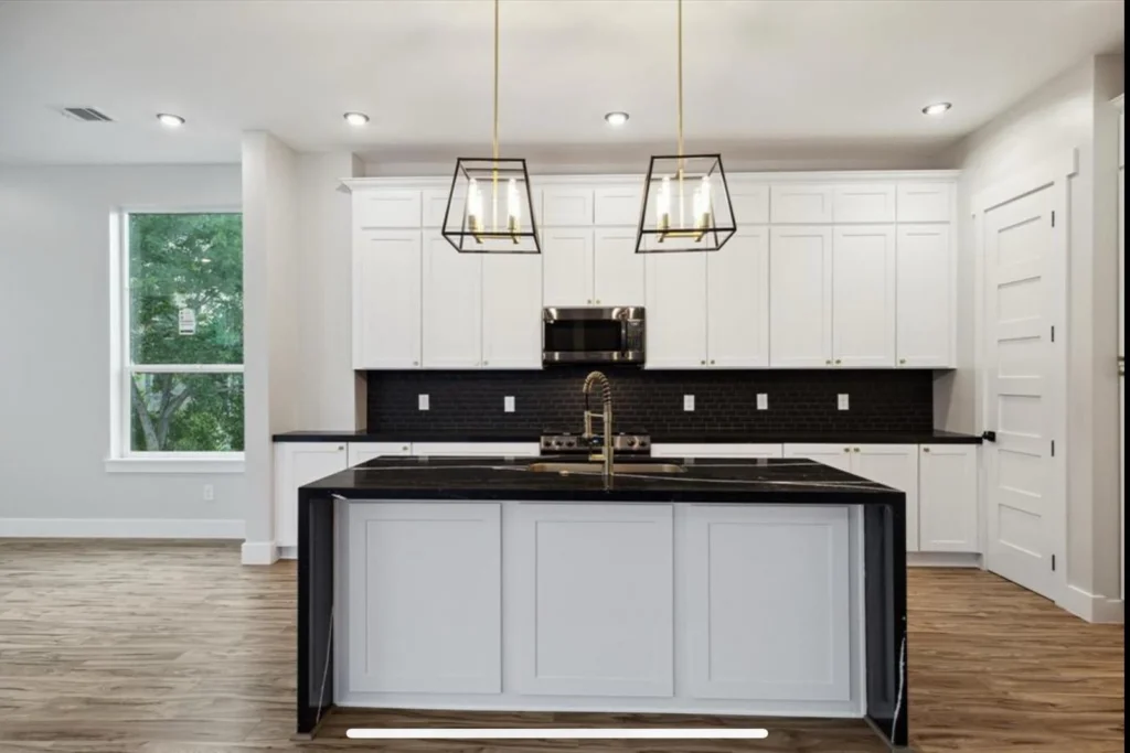 Kiam Street — Kitchen with island and pendant lighting