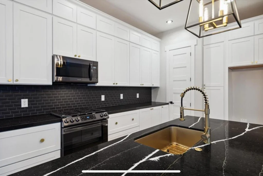 Kiam Street — Kitchen detail — stone counter and brass fittings