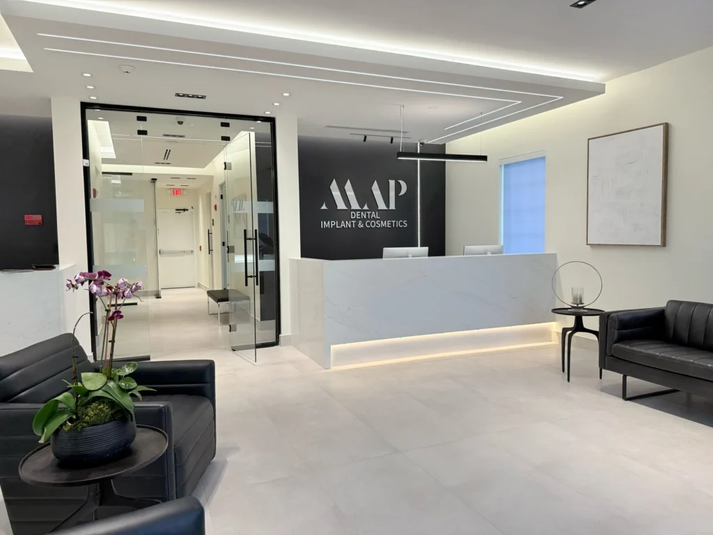 MAP Dental Implant & Cosmetics — reception desk and signage wall